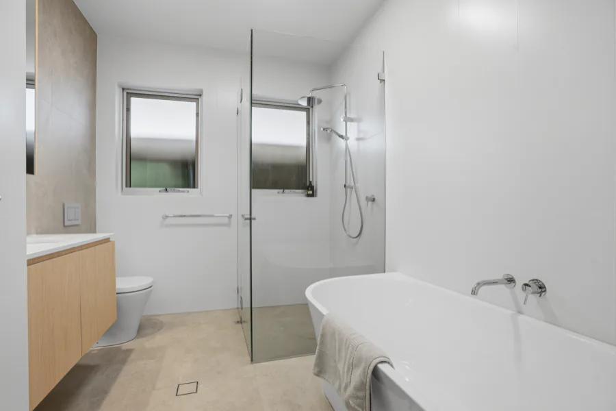 The main bathroom, with a walk-in shower and a bathtub