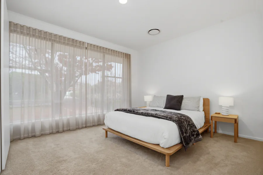 A queen bedroom looking out over the garden