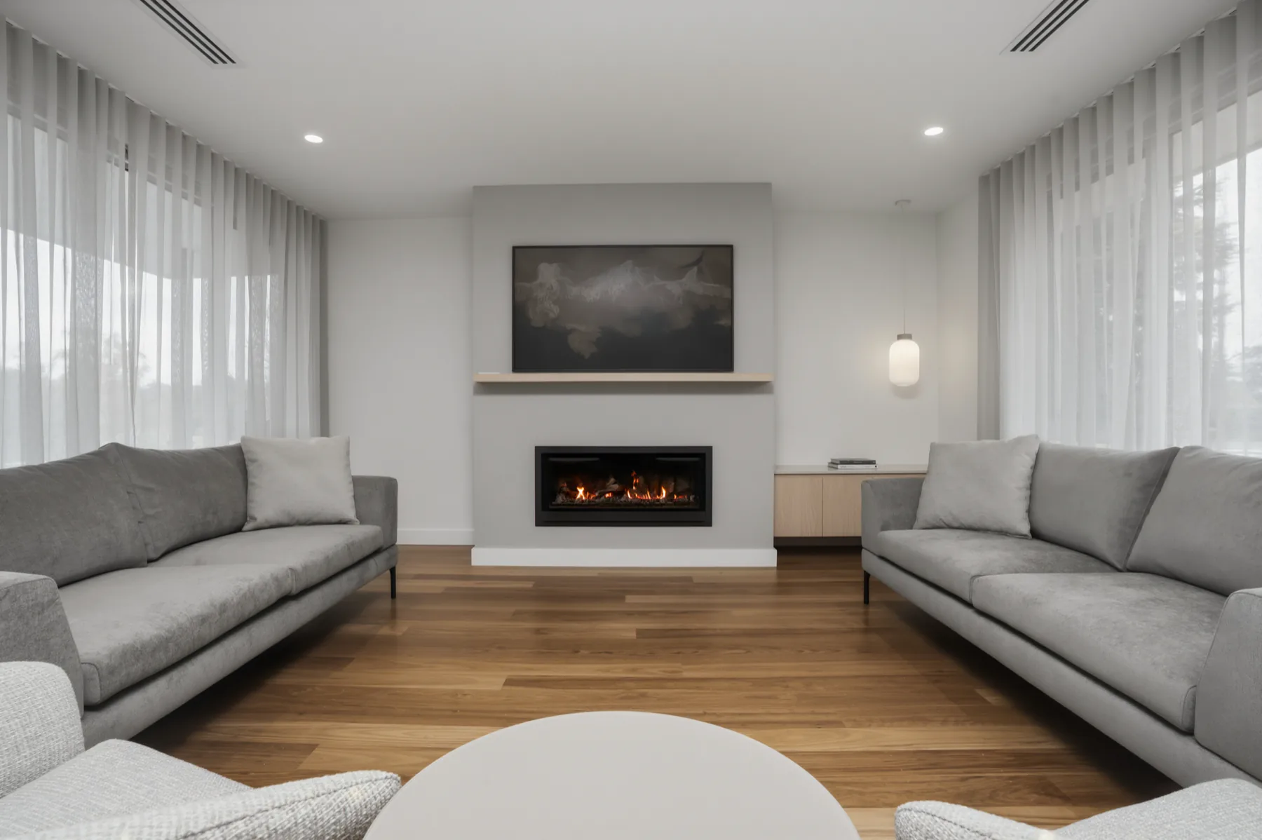 The living room with the gas fireplace lit