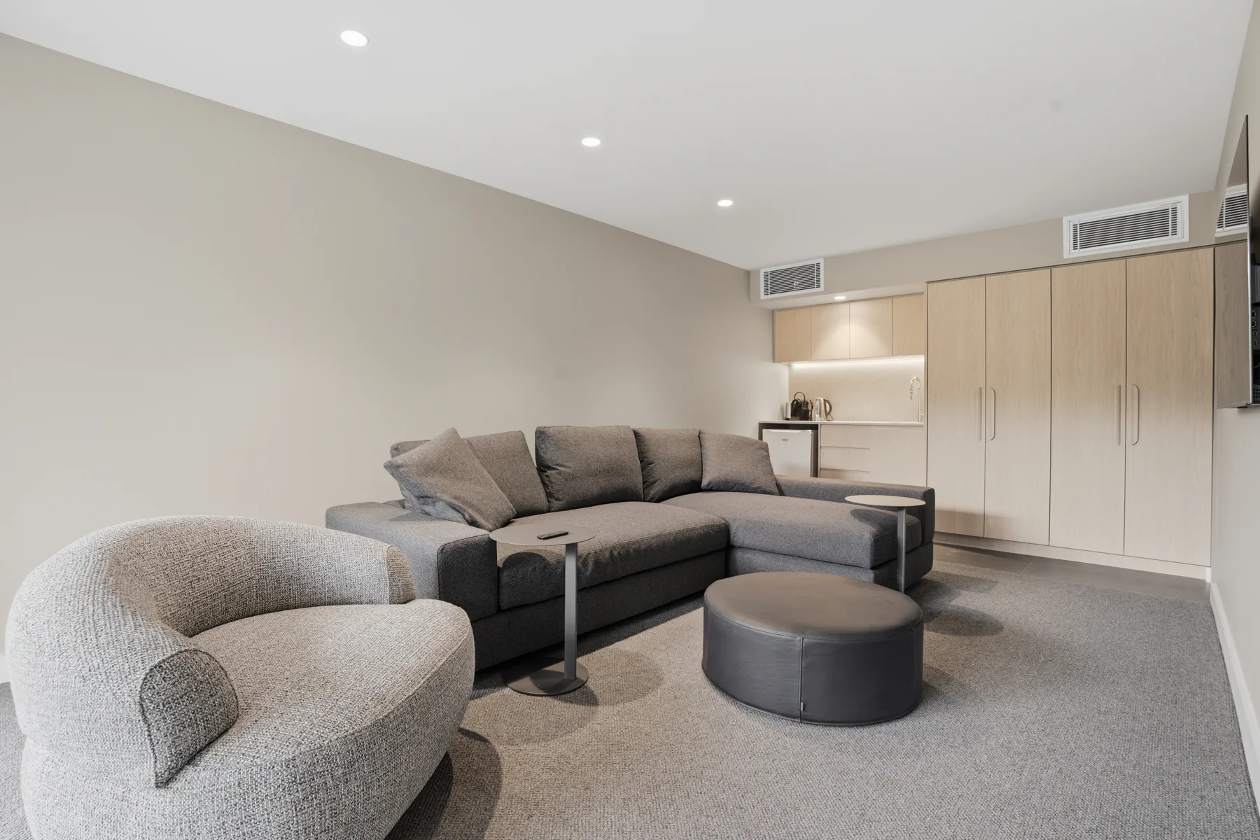 The downstairs studio, with a corner lounge and kitchenette
